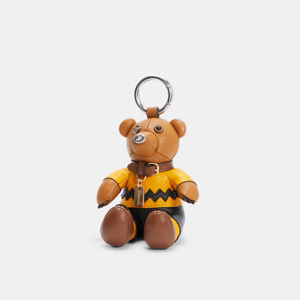 COACH COACH X PEANUTS CHARLIE BROWN BEAR COLLECTIBLE BAG CHARM - SV/LIGHT SADDLE MULTI - 5403