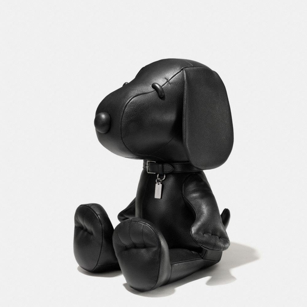 black snoopy doll