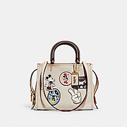 COACH 69182 Disney X Coach Rogue 25 With Patches BRASS/CHALK