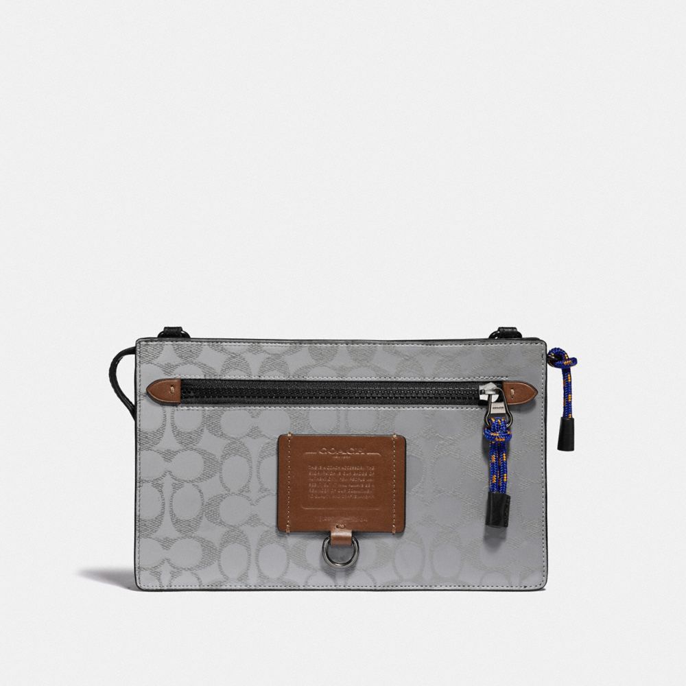 RIVINGTON CONVERTIBLE POUCH IN REFLECTIVE SIGNATURE CANVAS - SILVER/SADDLE/BLACK - COACH 79416