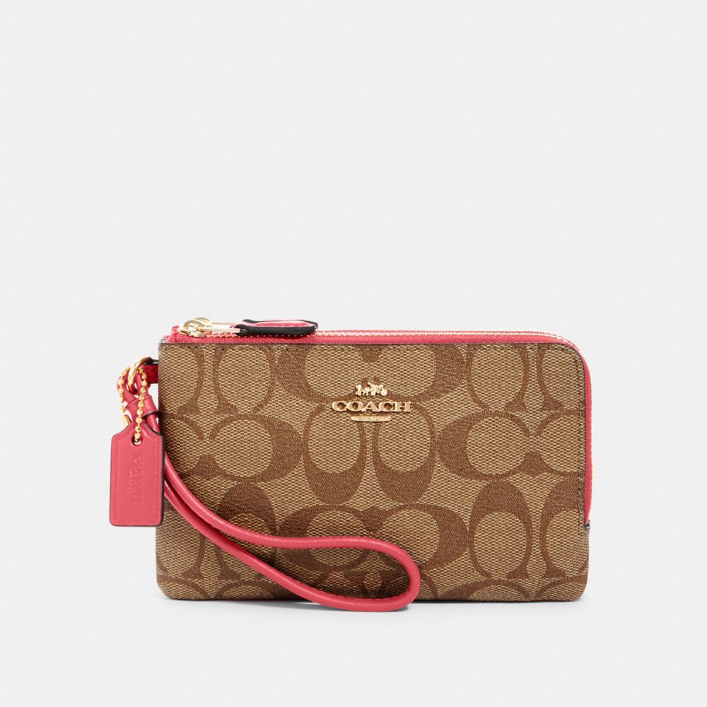 COACH DOUBLE CORNER ZIP WRISTLET IN SIGNATURE CANVAS - IM/KHAKI/FUCHSIA - 87591