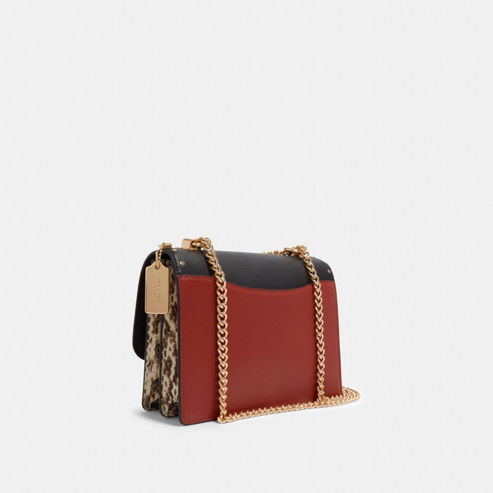 KLARE CROSSBODY IN SIGNATURE CANVAS WITH RIVETS