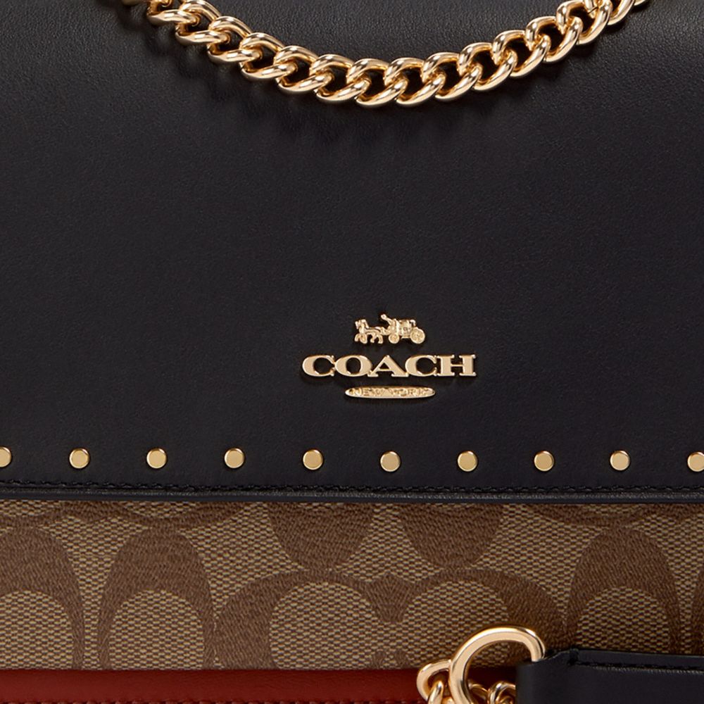 KLARE CROSSBODY IN SIGNATURE CANVAS WITH RIVETS