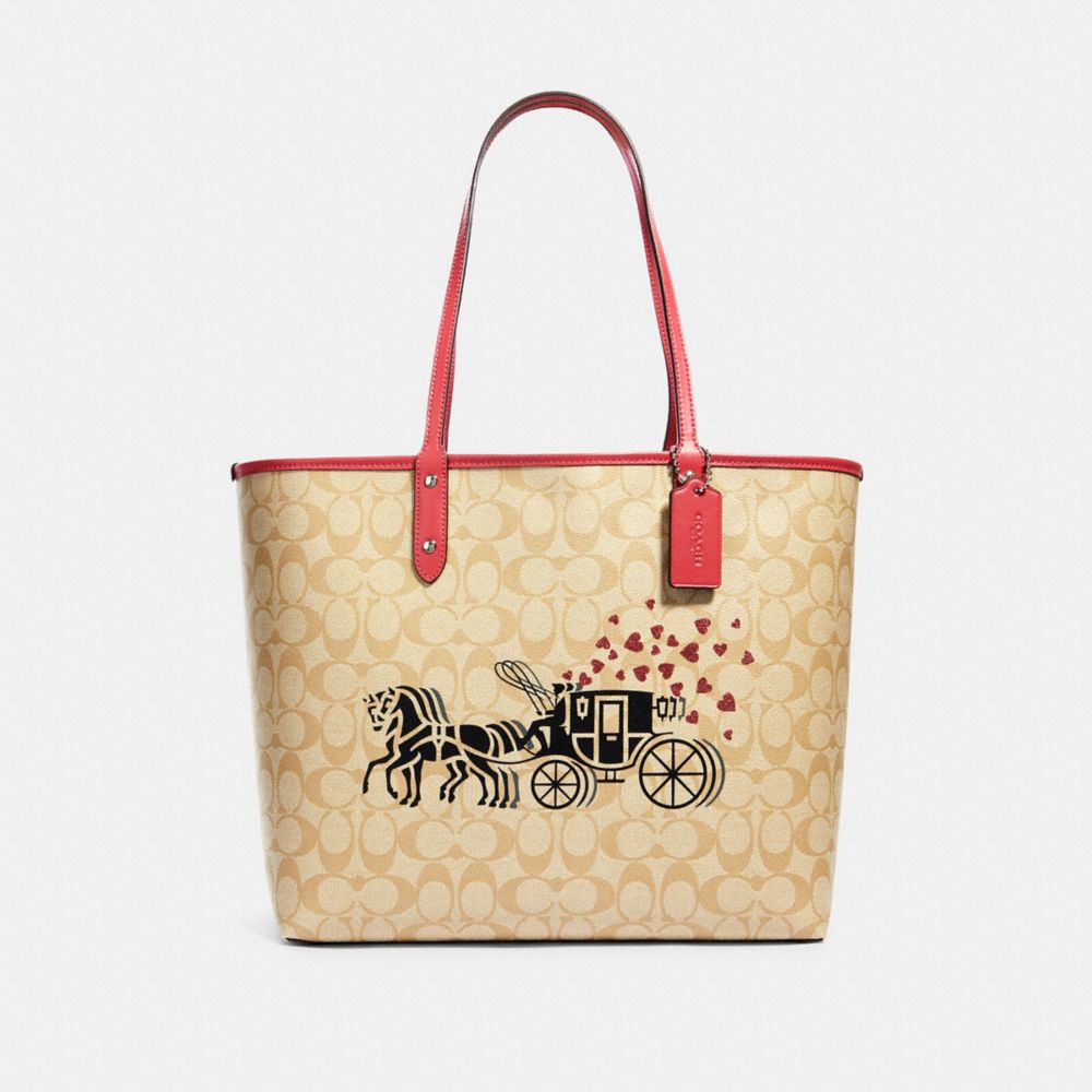 REVERSIBLE CITY TOTE IN SIGNATURE CANVAS WITH HORSE AND CARRIAGE HEARTS MOTIF - SV/LIGHT KHAKI MULTI/POPPY - COACH 91011