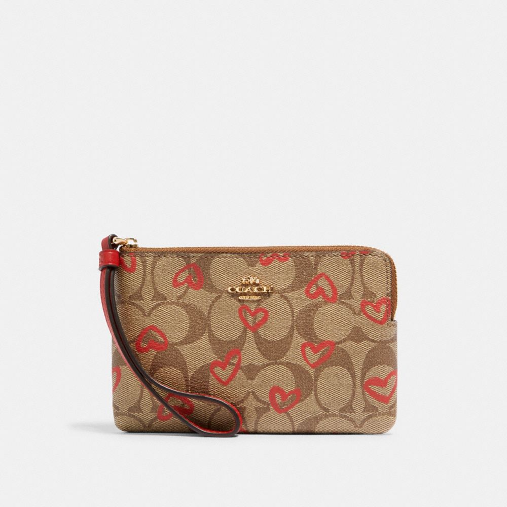 COACH 91076 CORNER ZIP WRISTLET IN SIGNATURE CANVAS WITH CRAYON HEARTS PRINT IM/KHAKI RED MULTI