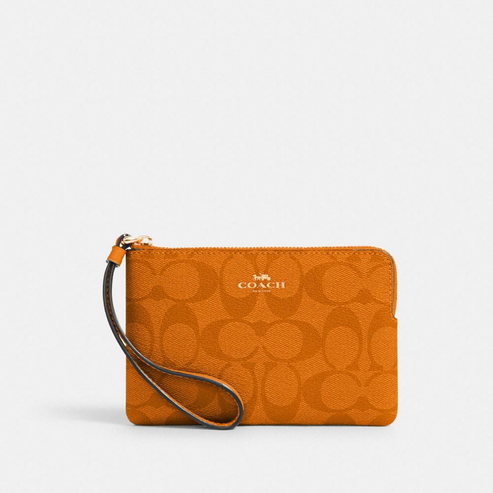 COACH 91178 Corner Zip Wristlet In Signature Canvas IM/LIGHT ORANGE