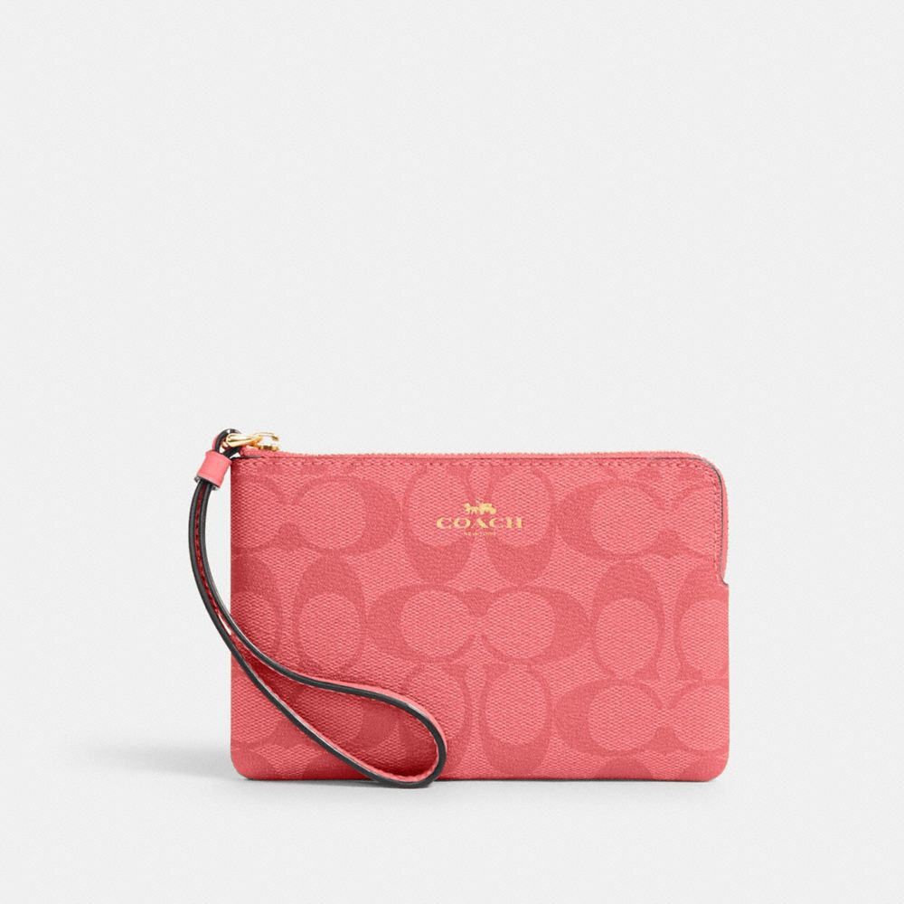 COACH Corner Zip Wristlet In Signature Canvas - GOLD/PINK LEMONADE - 91178