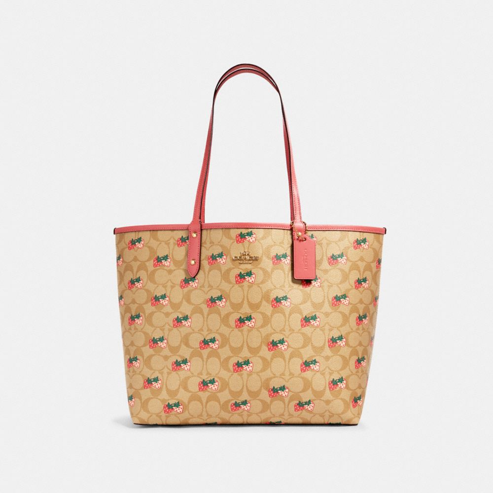 REVERSIBLE CITY TOTE IN SIGNATURE CANVAS WITH STRAWBERRY PRINT - 91515 - IM/KHAKI MULTI