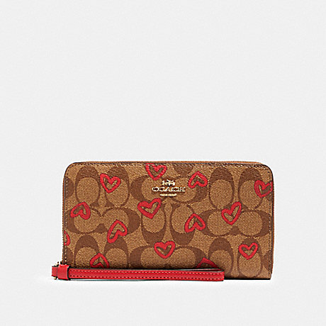 COACH 91578 LARGE PHONE WALLET IN SIGNATURE CANVAS WITH CRAYON HEARTS PRINT IM/KHAKI-RED-MULTI