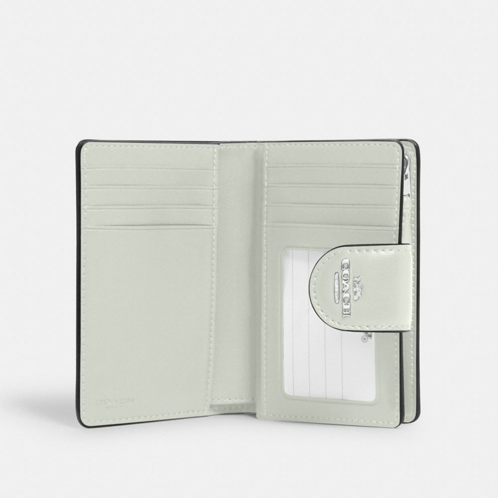 MEDIUM CORNER ZIP WALLET IN SIGNATURE CANVAS