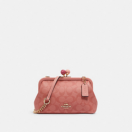 COACH NORA KISSLOCK CROSSBODY IN SIGNATURE CANVAS - IM/CANDY PINK - C1452
