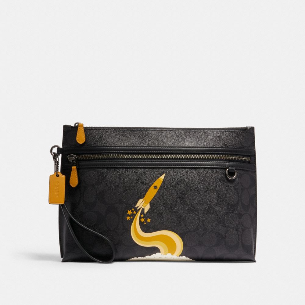 COACH CARRYALL POUCH IN SIGNATURE CANVAS WITH TRIUMPH MOTIF - QB/BLACK YELLOW - C1604