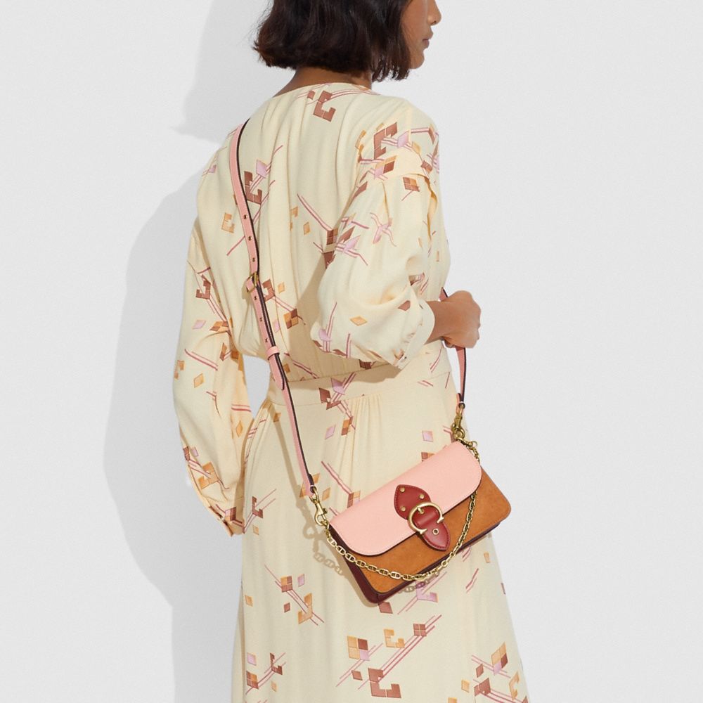 BEAT 撞色斜背手拿包