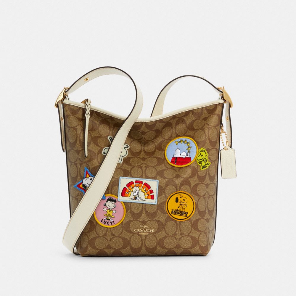 COACH C4112 COACH X PEANUTS VAL DUFFLE IN SIGNATURE CANVAS WITH VARSITY PATCHES IM/KHAKI CHALK MULTI