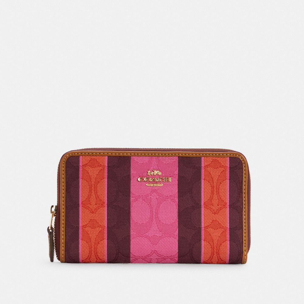 COACH MEDIUM ID ZIP WALLET IN SIGNATURE JACQUARD WITH STRIPES - IM/PINK/BURGUNDY MULTI - C4297