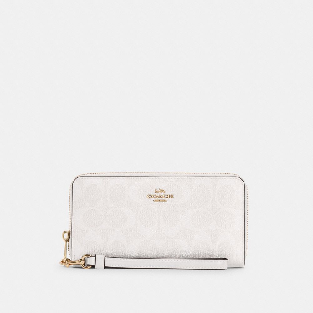 COACH LONG ZIP AROUND WALLET IN SIGNATURE CANVAS - ONE COLOR - C4452