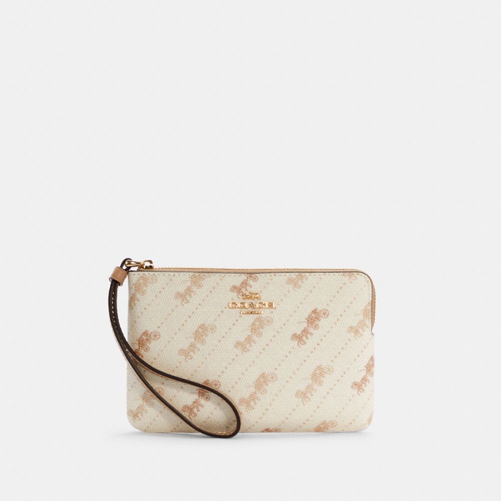 COACH CORNER ZIP WRISTLET WITH HORSE AND CARRIAGE DOT PRINT - IM/CREAM - C4466