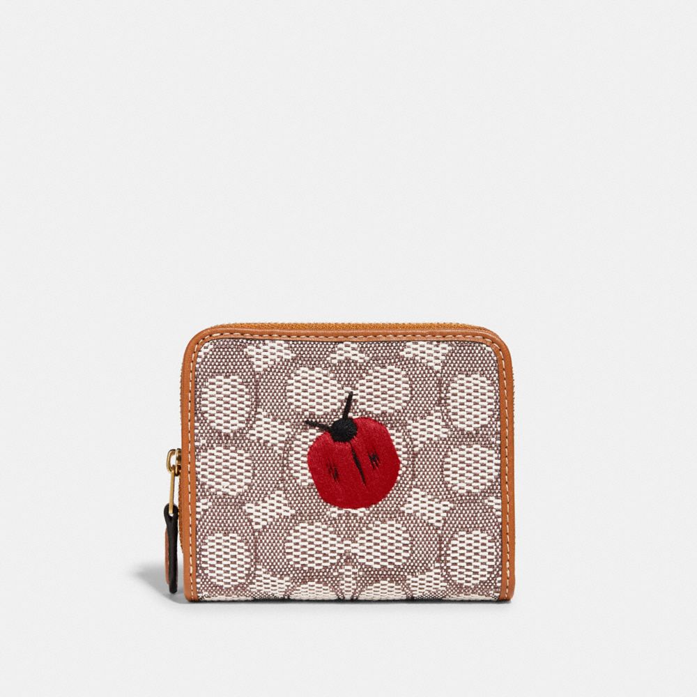 BILLFOLD WALLET IN SIGNATURE TEXTILE JACQUARD WITH LADYBUG MOTIF EMBROIDERY