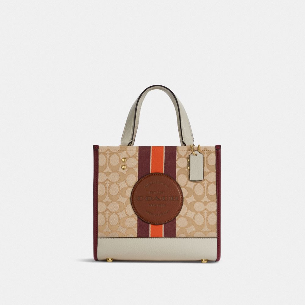 COACH Dempsey Tote 22 In Signature Jacquard With Stripe And Coach Patch - GOLD/LIGHT KHAKI/WINE MULTI - C7083