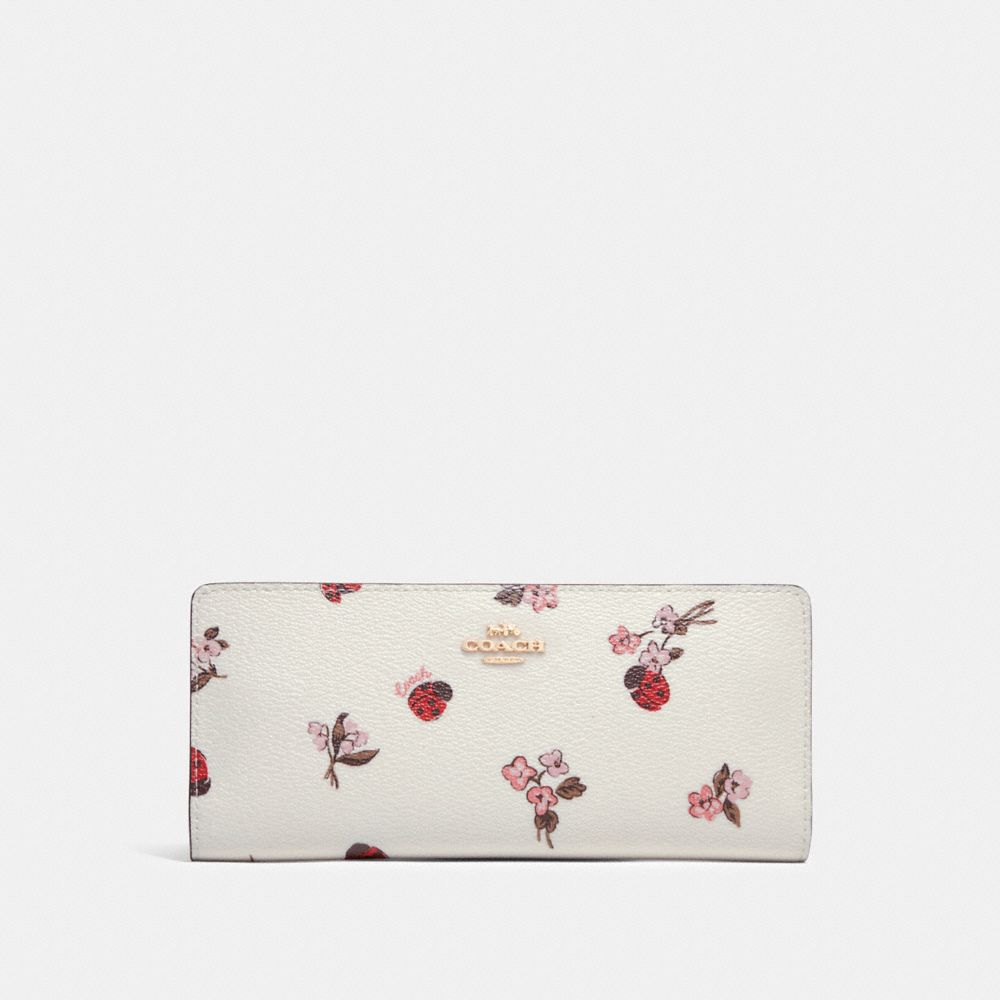 COACH Slim Wallet With Ladybug Floral Print - GOLD/CHALK MULTI - C7306