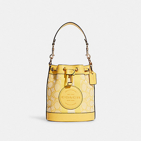 COACH Mini Dempsey Bucket Bag In Signature Jacquard With Stripe And Coach Patch - GOLD/RETRO YELLOW - C8322