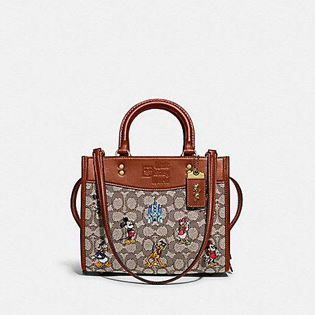 COACH C8553 Disney X Coach Rogue 25 In Signature Textile Jacquard With Mickey Mouse And Friends Embroidery Brass/Cocoa Burnished Amber Multi