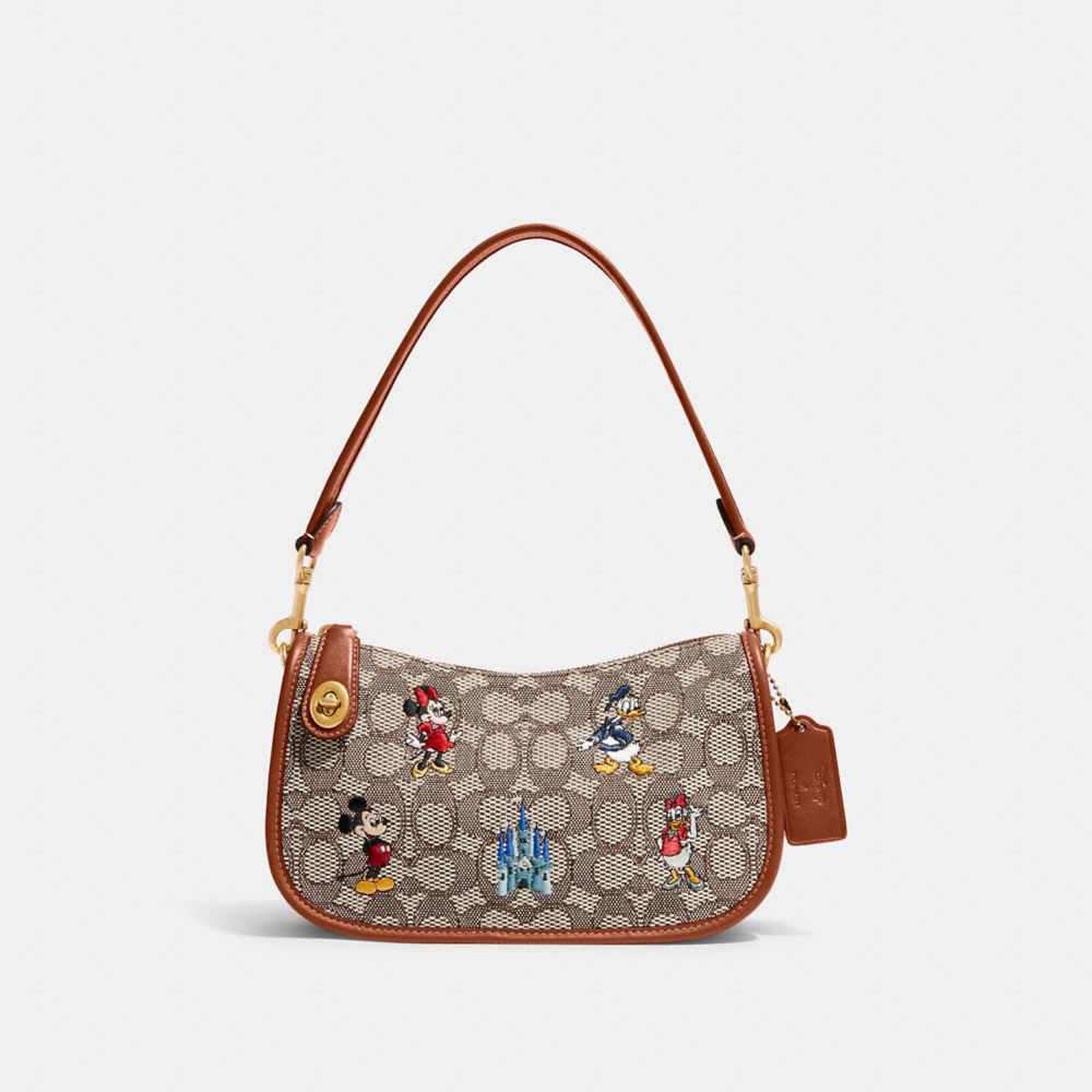 COACH C8620 Disney X Coach Swinger Bag In Signature Textile Jacquard With Mickey Mouse And Friends Embroidery Brass/Cocoa Burnished Amber Multi