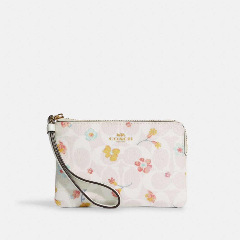 CORNER ZIP WRISTLET IN SIGNATURE CANVAS WITH MYSTICAL FLORAL PRINT