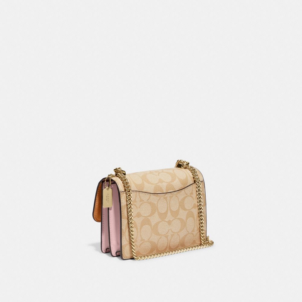 MINI KLARE CROSSBODY IN SIGNATURE CANVAS