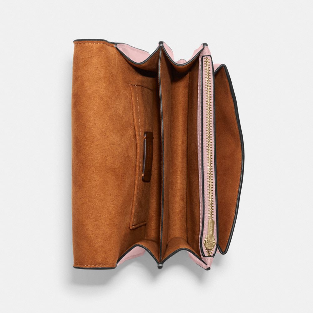 MINI KLARE CROSSBODY IN SIGNATURE CANVAS