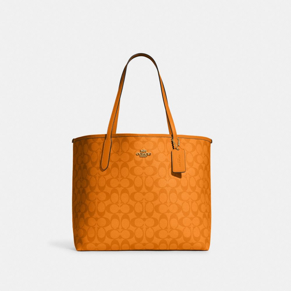 City Tote In Blocked Signature Canvas - IM/LIGHT ORANGE - COACH CA157