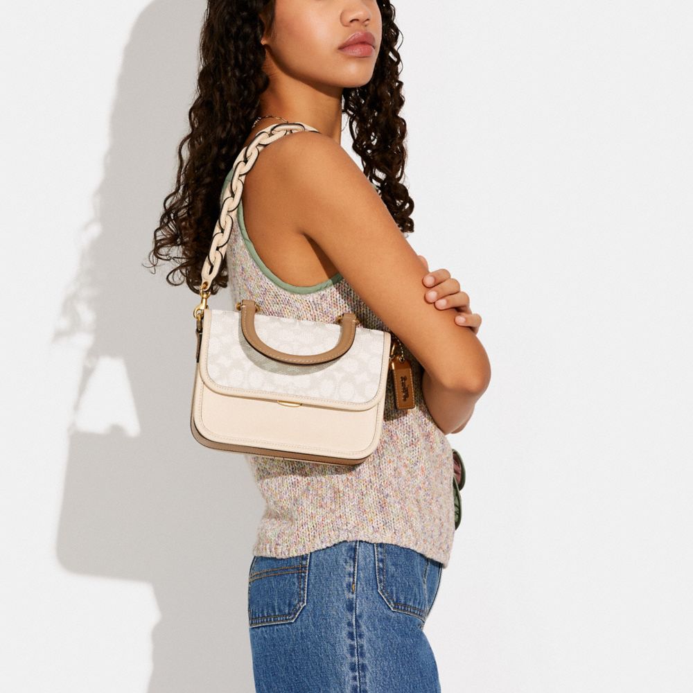 ROGUE TOP HANDLE IN SIGNATURE JACQUARD