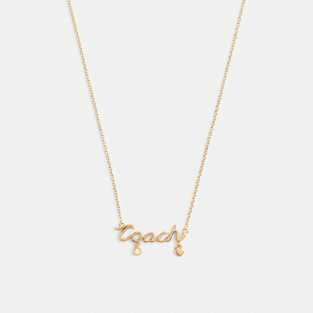 COACH&reg;,Coach Script Heart Necklace,Single Strand,Cubic Zirconia,Glass,Lettering Word,Logo,Gem Embellishment,Heart Embellis...,Clear,Front View