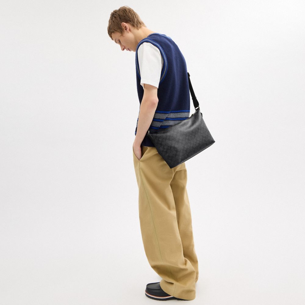 FINN CROSSBODY BAG IN SIGNATURE CANVAS