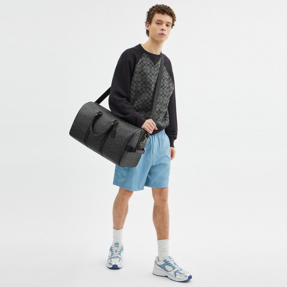 VENTURER BAG IN SIGNATURE CANVAS