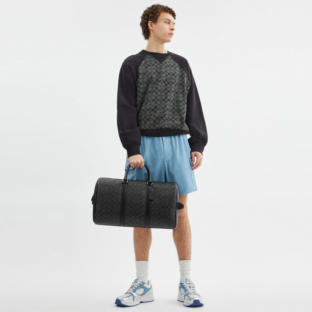 VENTURER BAG IN SIGNATURE CANVAS