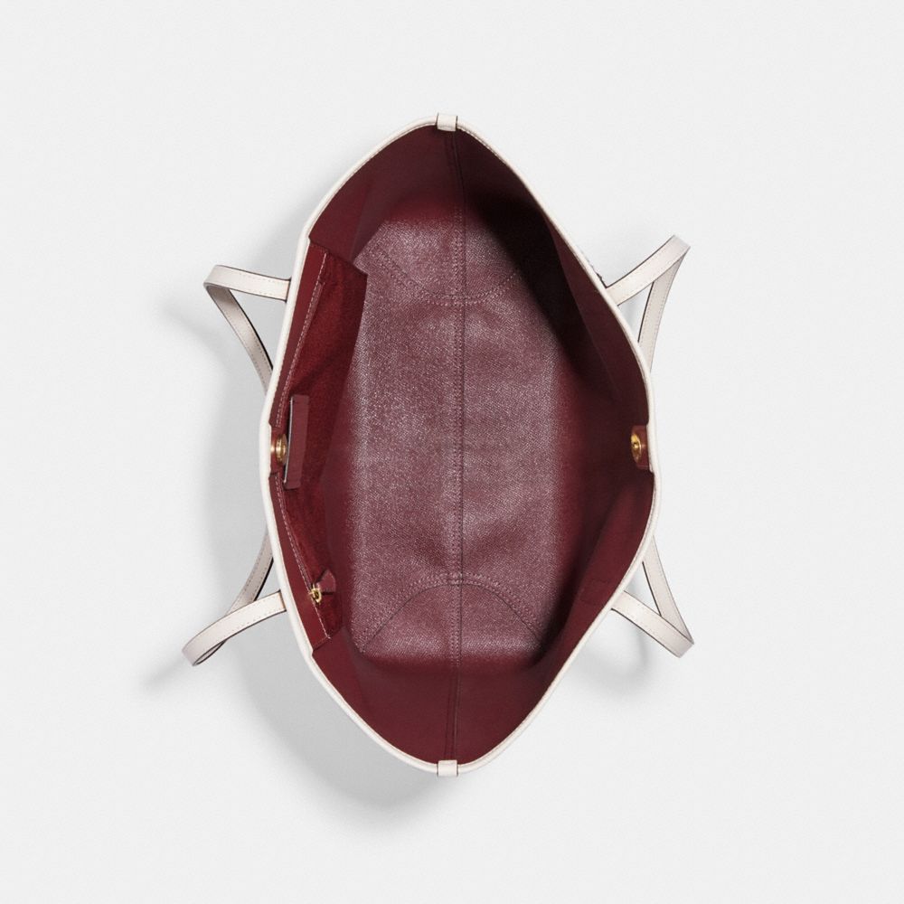 CITY TOTE IN SIGNATURE CANVAS WITH VARSITY MOTIF