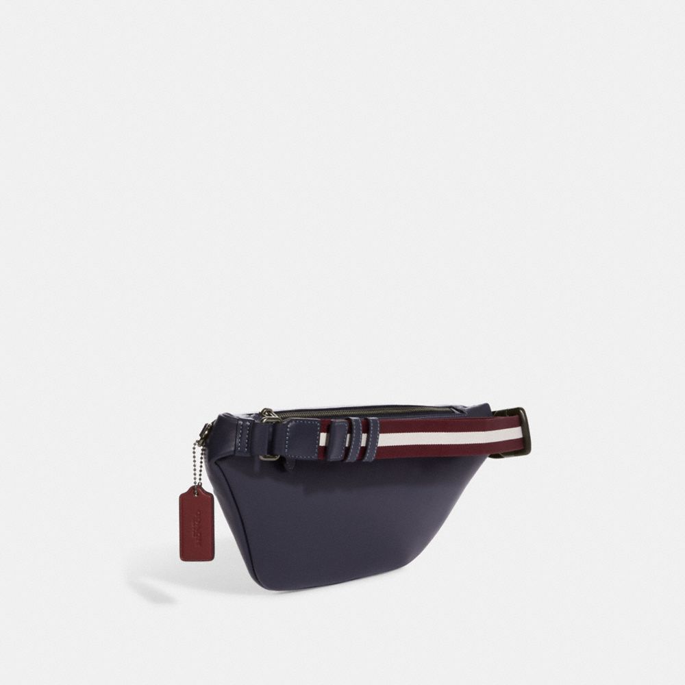 WARREN BELT BAG IN SIGNATURE CANVAS WITH VARSITY MOTIF