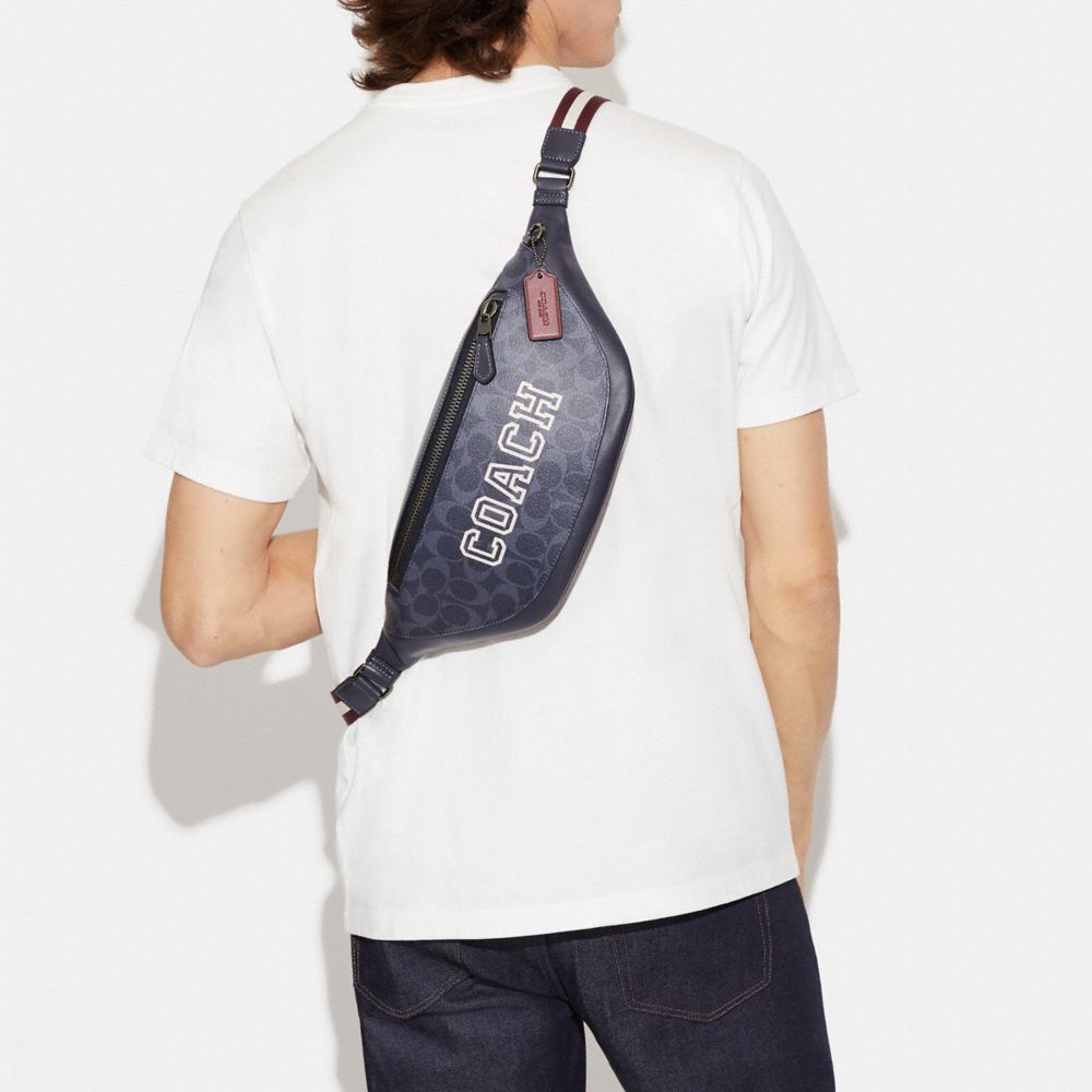 WARREN BELT BAG IN SIGNATURE CANVAS WITH VARSITY MOTIF