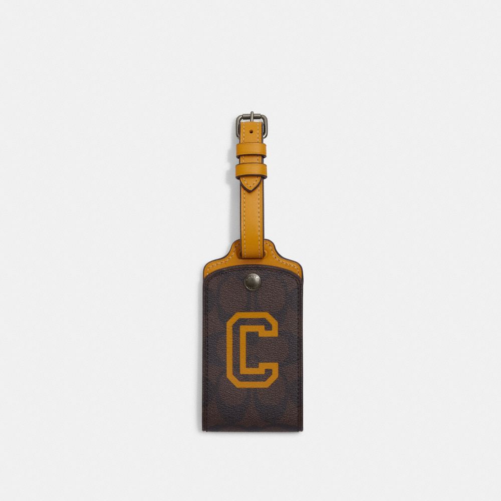 Luggage Tag In Signature Canvas With Varsity Motif - CB921 - QB/Mahogany/Buttercup