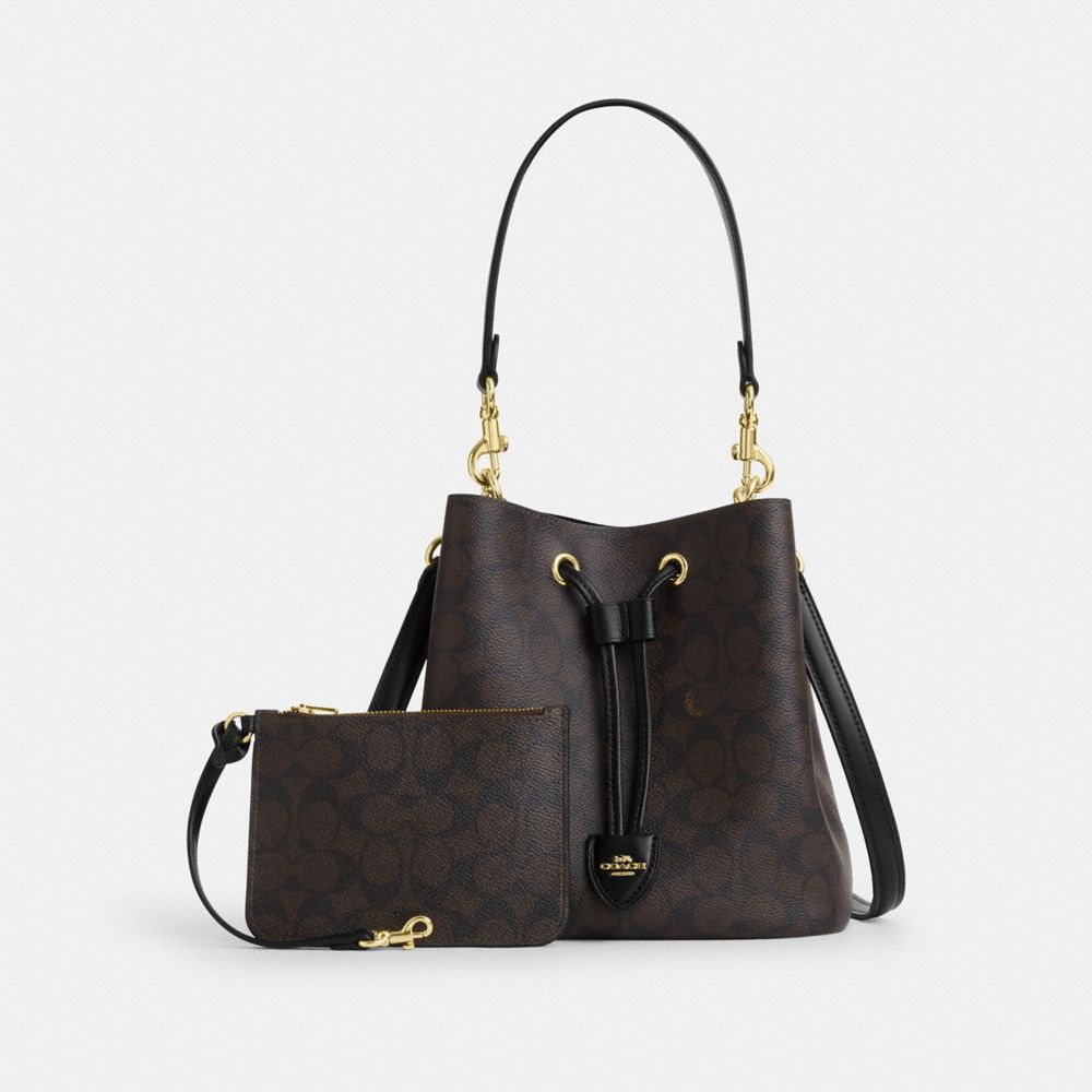 ROWAN BUCKET BAG IN SIGNATURE CANVAS
