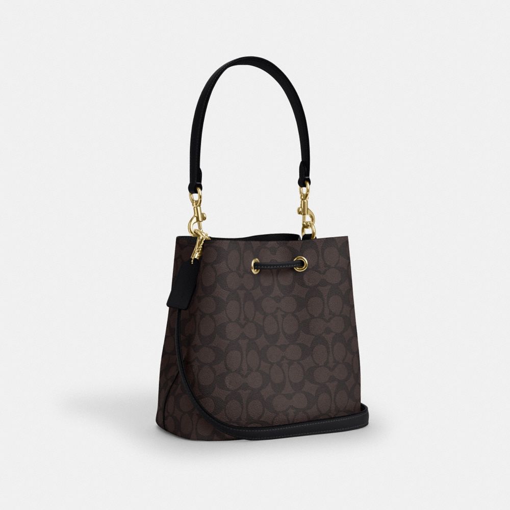ROWAN BUCKET BAG IN SIGNATURE CANVAS