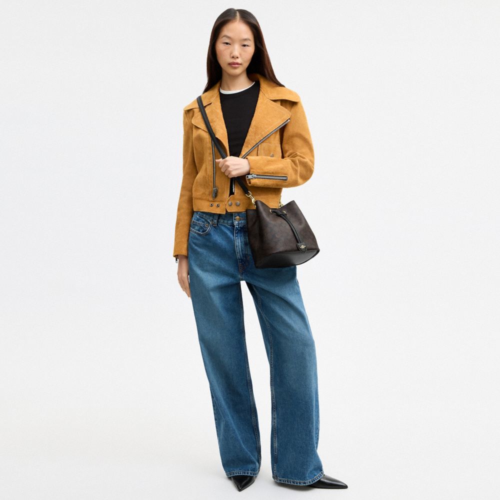 ROWAN BUCKET BAG IN SIGNATURE CANVAS