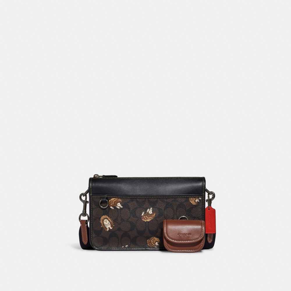 HERITAGE CONVERTIBLE CROSSBODY IN SIGNATURE CANVAS WITH CREATURE PRINT