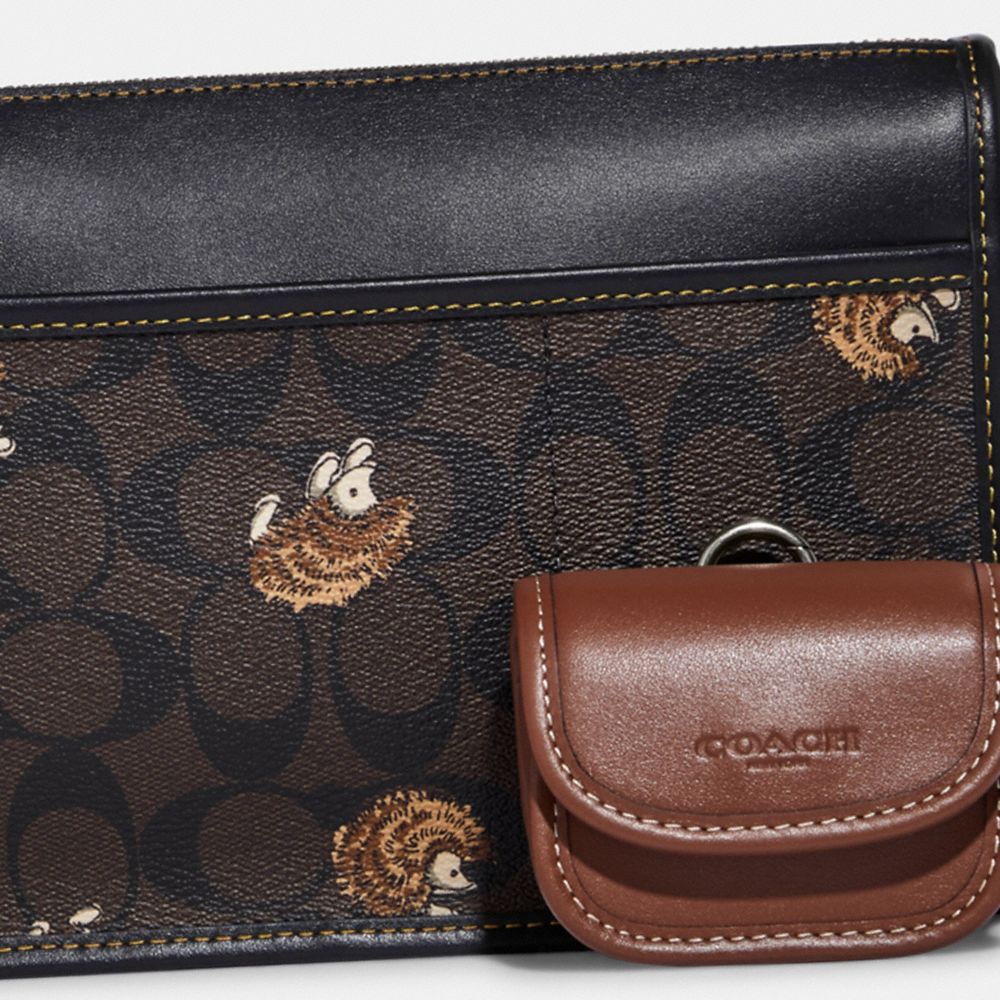 HERITAGE CONVERTIBLE CROSSBODY IN SIGNATURE CANVAS WITH CREATURE PRINT