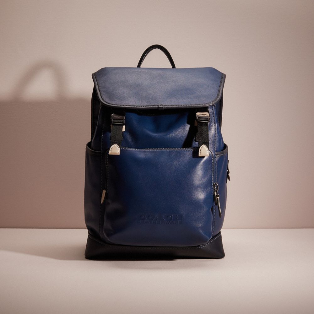 CC996 - Restored League Flap Backpack 
In Colorblock Black Copper/Deep Blue Multi