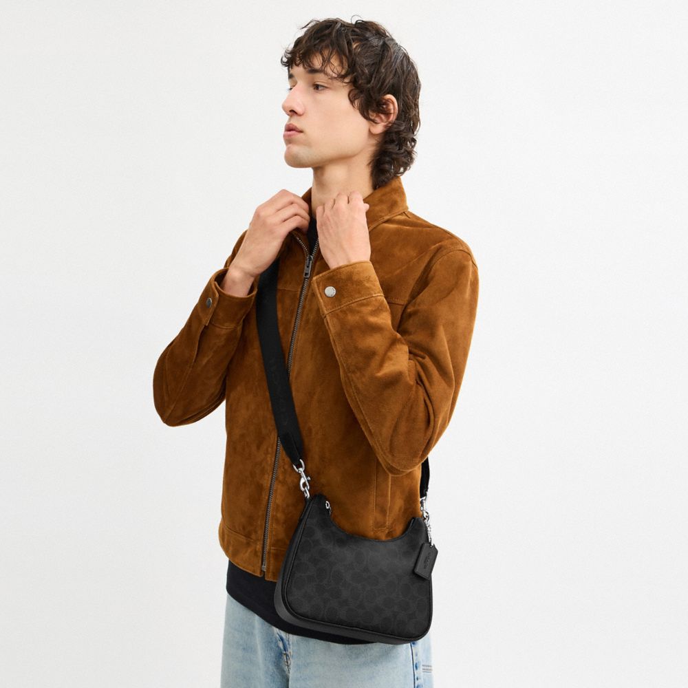 NOLAN HOBO BAG IN SIGNATURE CANVAS