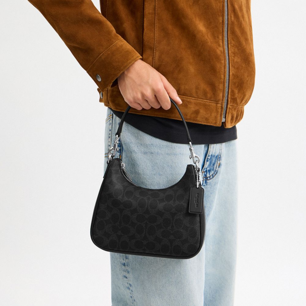NOLAN HOBO BAG IN SIGNATURE CANVAS