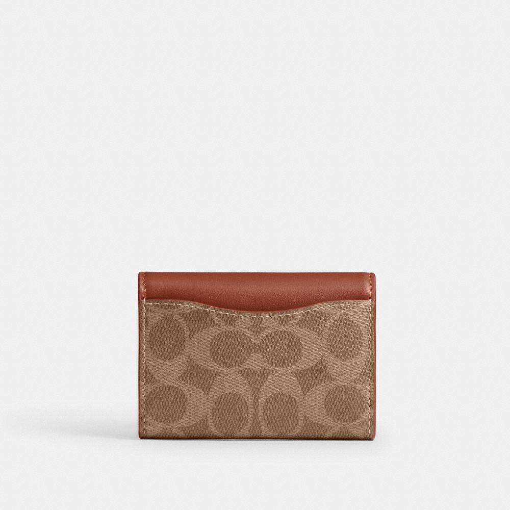 ESSENTIAL FLAP CARD CASE IN SIGNATURE CANVAS