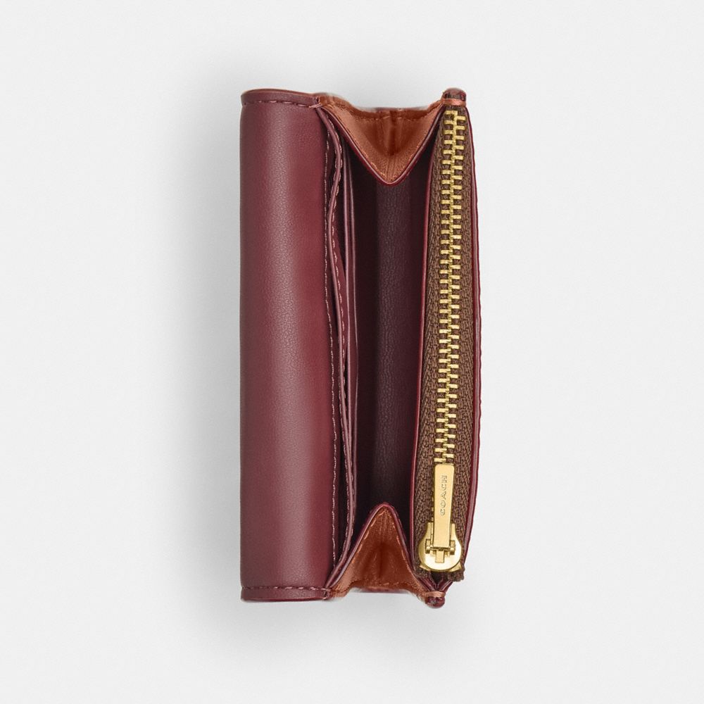 ESSENTIAL FLAP CARD CASE IN SIGNATURE CANVAS